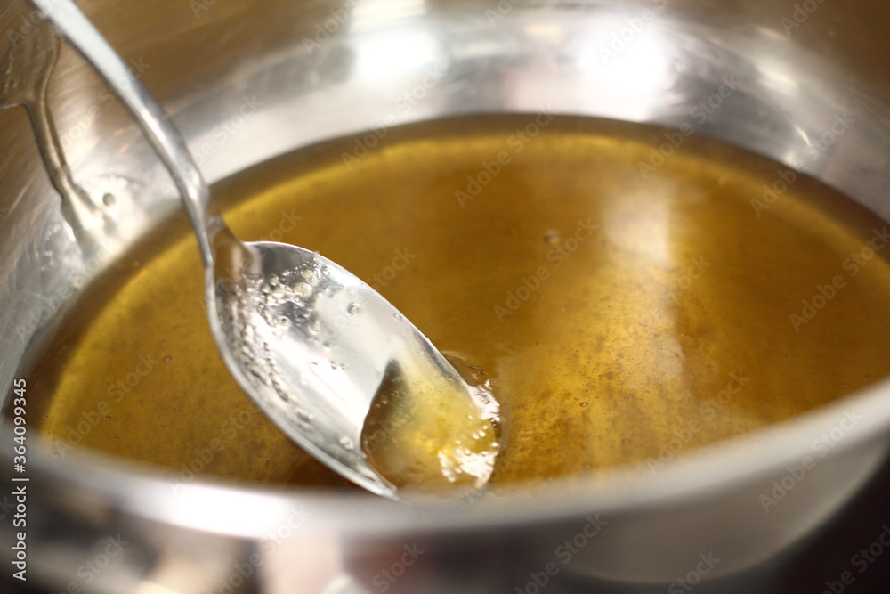 Melting golden syrup in saucepan. Making Shoofly Tart Series. Melting golden syrup in saucepan. Making Shoofly Tart Series.