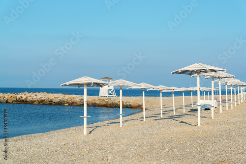 Beach umbrellas on the beach in the city of Nebug  Russia.