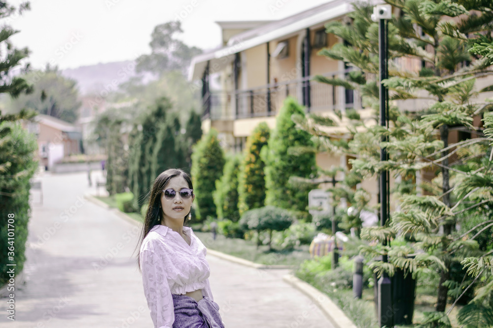 Beautiful asian girl with green brush of tree, Asian women with landscape nature