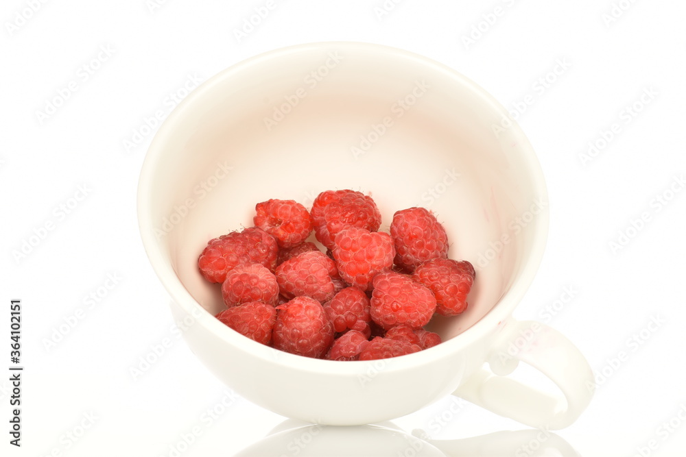 Juicy organic raspberries, close-up, on a white background. Juicy organic raspberries, close-up, on a white background.