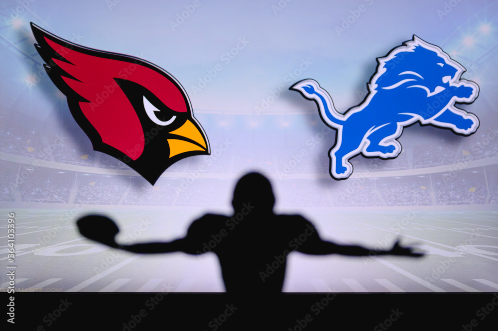 Arizona Cardinals vs. Detroit Lions. NFL Game. American Football League  match. Silhouette of professional player celebrate touch down. Screen in  background. Stock Photo