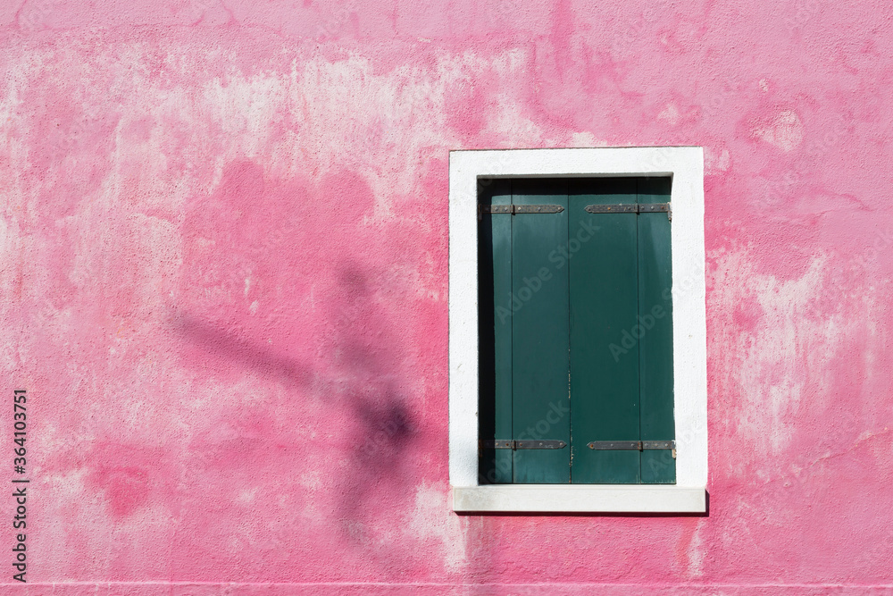 Window shutters closed on pink wall, Burano, Venice