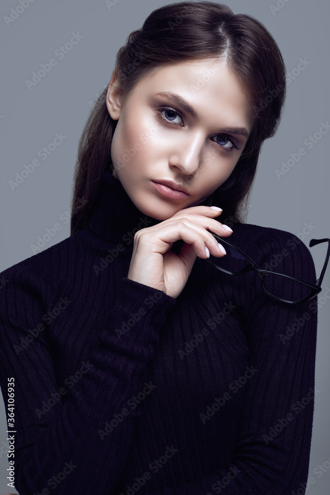 Cute student girl wearing black turtleneck sweater and stylish eyeglasses Cute student girl wearing black turtleneck sweater and stylish eyeglasses
