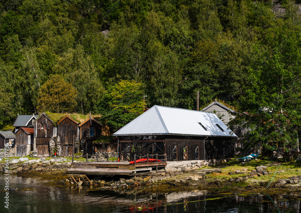 Old wooden buildings by the waters at Geiranger Norway Old wooden buildings by the waters at Geiranger Norway