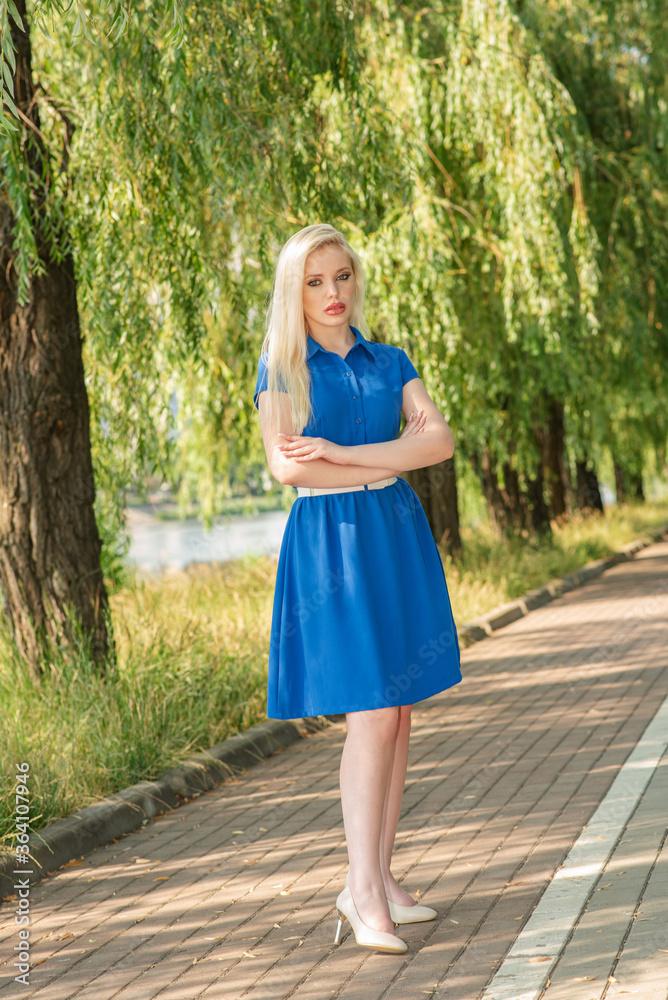 Portrait of a beautiful blonde girl outdoors in summer Portrait of a beautiful blonde girl outdoors in summer