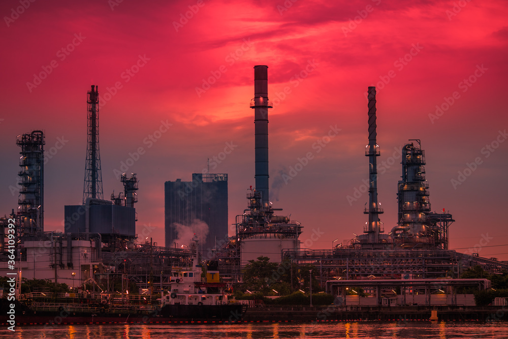 Blurred natural background of the morning sunshine along the river, breathtaking views (cargo ship, oil refinery), boat transportation