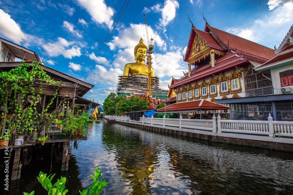 Background of a large Buddha statue in Bangkok (Wat Pak Nam Phasi Charoen), over 69 meters in height, stands majestically in the capital, a historical and cultural attraction that tourists come to see