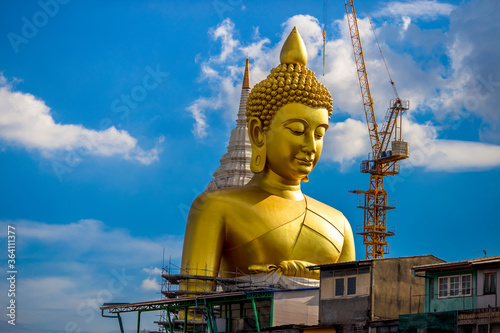 Background of a large Buddha statue in Bangkok  Wat Pak Nam Phasi Charoen   over 69 meters in height  stands majestically in the capital  a historical and cultural attraction that tourists come to see