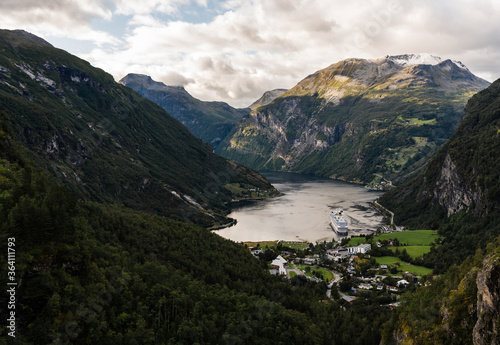 Geiranger fjord seen from the hillside on summer day with one cruise ship in port, Norway