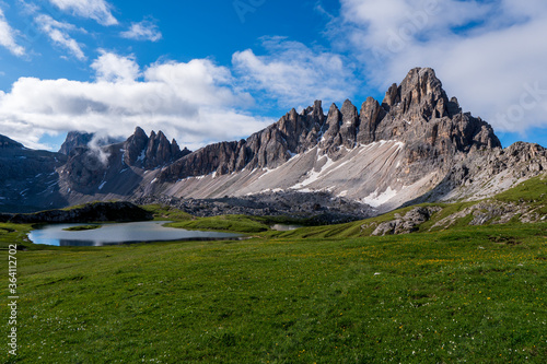 Dolomites Alps. Lago dei Piani. Italy. Two alpine lakes on background of dolomite grey peak Crode dei Piani mountain wrapped by white clouds. Desert view photo