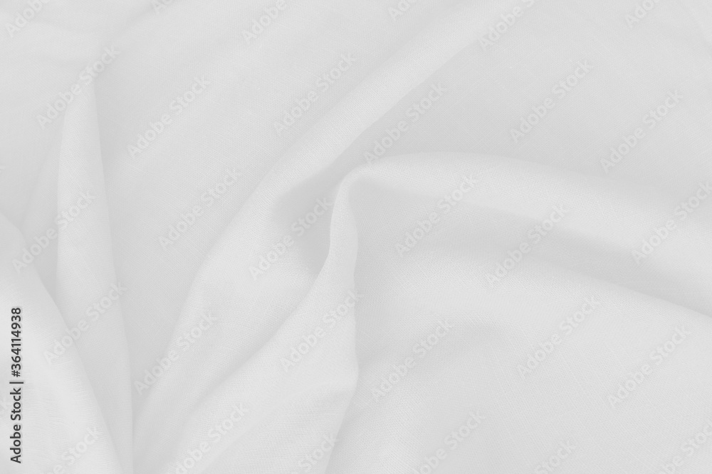 Close Up of cotton white fabric texture, abstract. It has a soft look that like a wave suitable for background, backdrop.