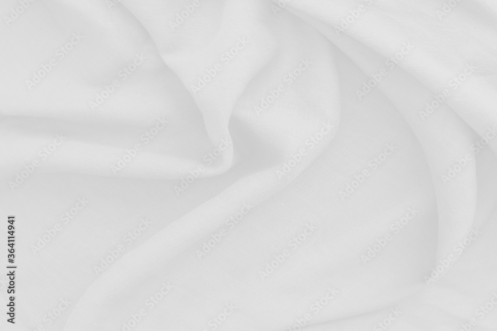 Close Up of cotton white fabric texture, abstract. It has a soft look that like a wave suitable for background, backdrop.