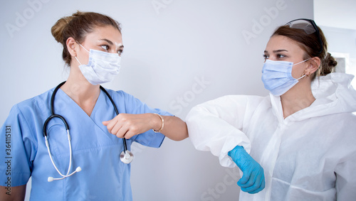 woman doctors protective hand shaking