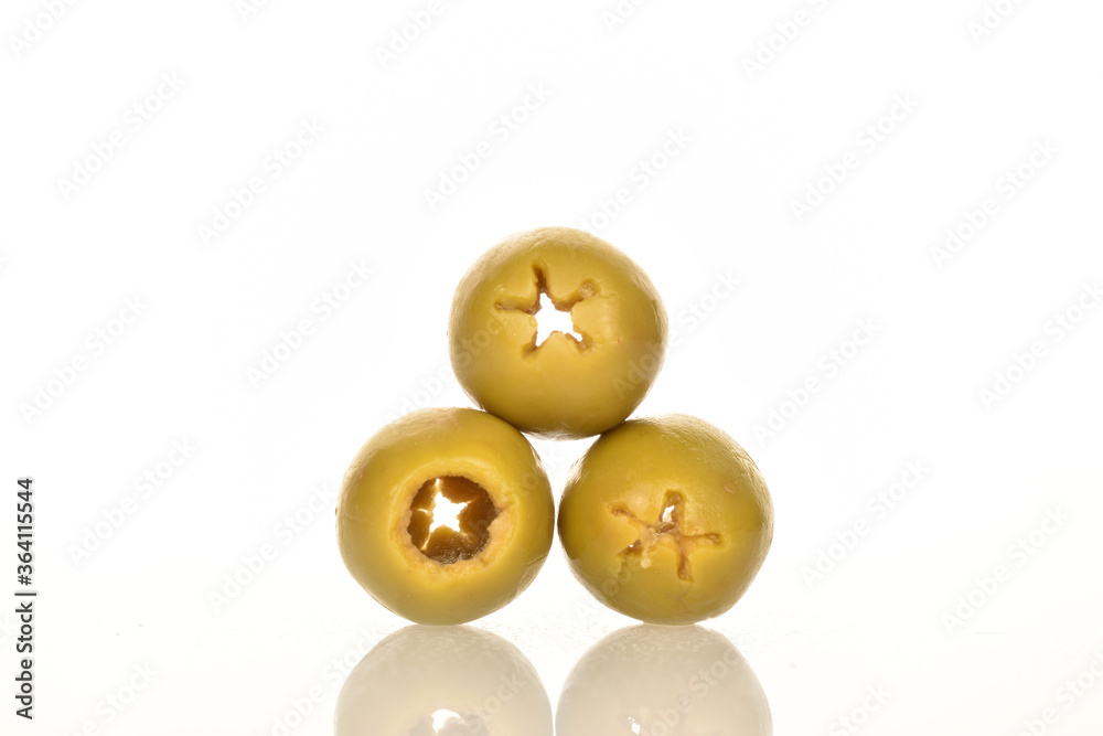 Tinned green pitted olives, close-up, isolated on white.