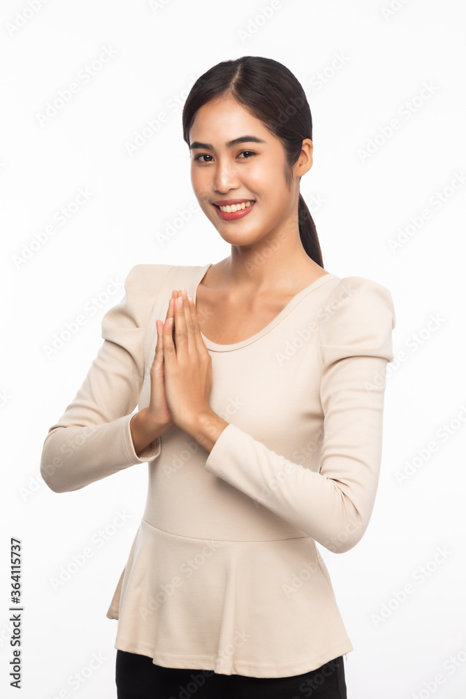 Portrait of young asian business woman greeting with Thai culture Sawasdee, welcome expression isolated on white background. Portrait of young asian business woman greeting with Thai culture Sawasdee, welcome expression isolated on white background.
