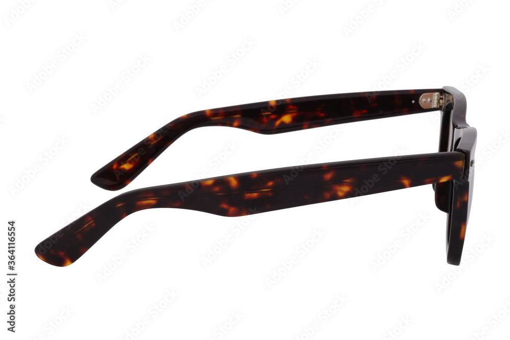 Sunglasses with a black-brown plastic frame and brown lenses isolated on white background.