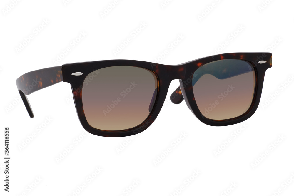 Sunglasses with a black-brown plastic frame and brown lenses isolated on white background.
