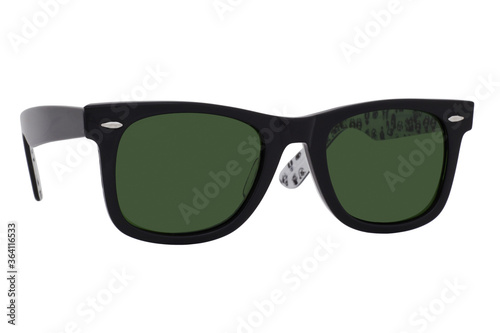 Sunglasses with a black plastic frame and green lenses isolated on white background.