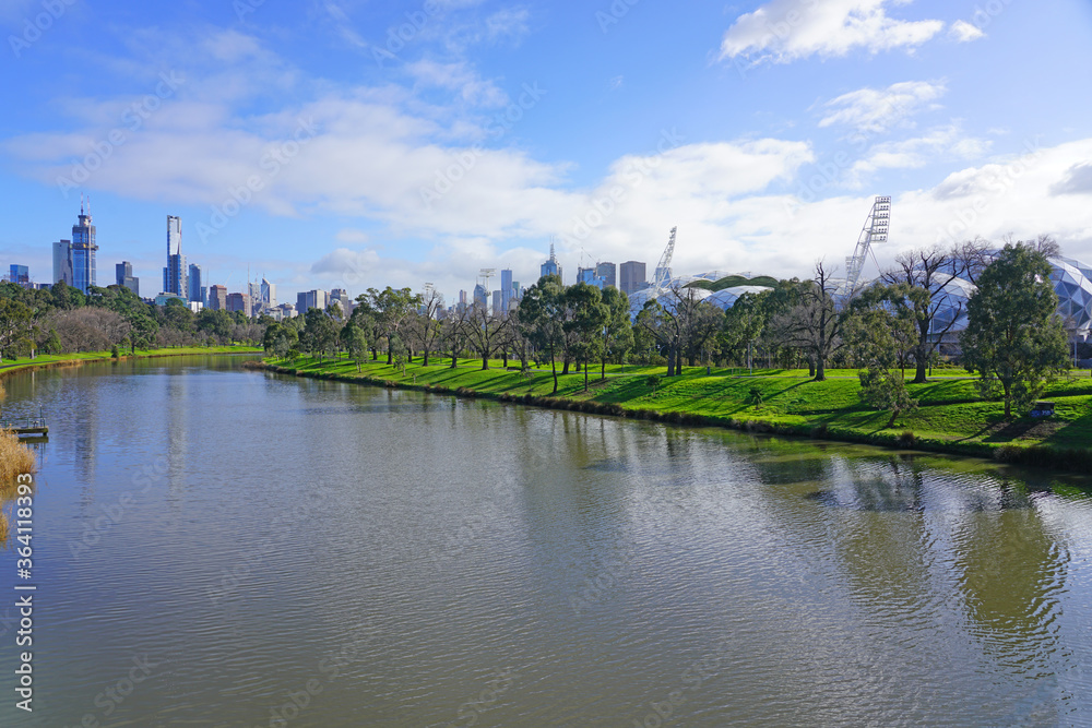 Obraz premium MELBOURNE, AUSTRALIA -15 JUL 2019- Day view of the downtown Melbourne City Centre central business district (CBD) skyline along the Yarra River in Melbourne, Victoria, Australia.