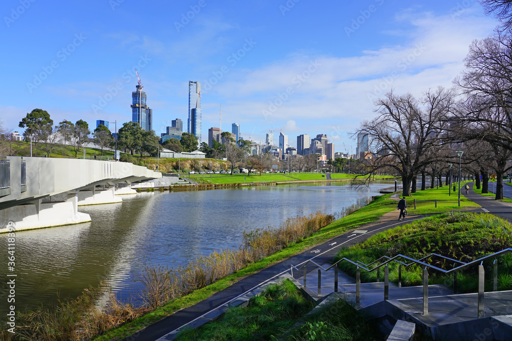 MELBOURNE, AUSTRALIA -15 JUL 2019- Day view of the downtown Melbourne City Centre central business district (CBD) skyline along the Yarra River in Melbourne, Victoria, Australia.