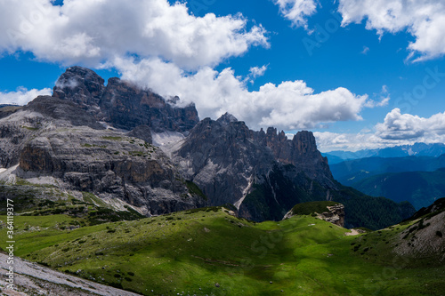 Amazing rocky mountains covered with clouds, Tre Cime di Lavaredo park, Dolomites, Italy