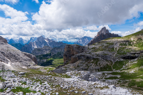 Marvelous game of light and shadow over the Dolomites mountain scenery while hiking the Tre Cime di Lavaredo trail in Parco Naturale Tre Cime, South Tyrol, Italy