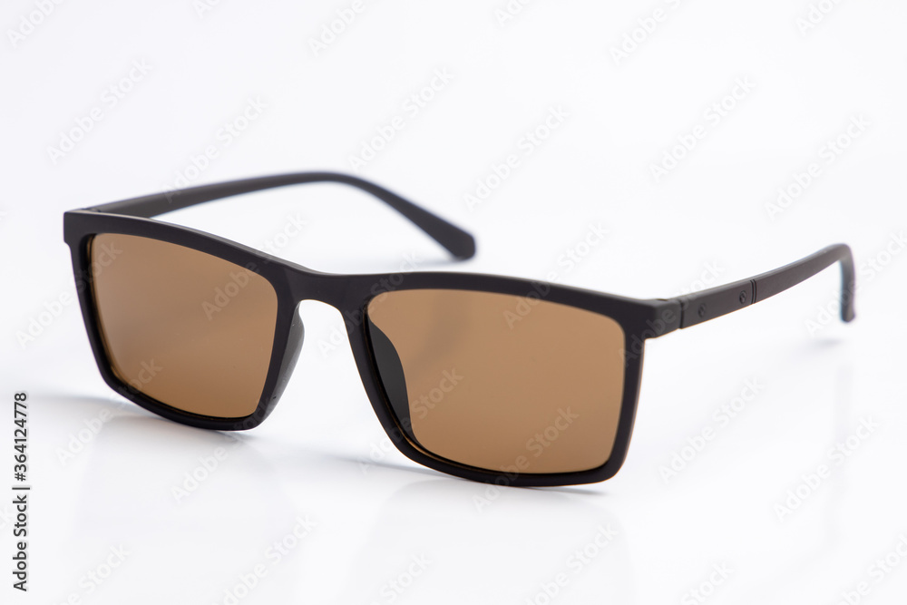 Sunglasses with brown lenses on white isolated background. female or male , fashion