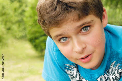 portrait of surprased teen on a nature background