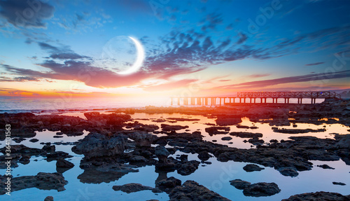 Fototapeta Naklejka Na Ścianę i Meble -  Long exposure photo of Mersin coast with wooden pier - Long exposure image of Dramatic sky and seascape with rock New moon over the sea