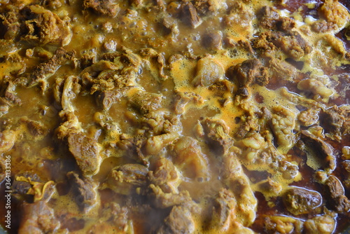 Vendor Cooking traditional meat Curry at Indonesian street food market