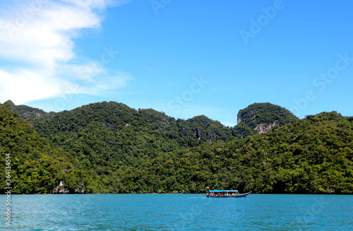 landscape view of small Island in sea of with boat and blue sky and water at langkawi (Malaysia) © ARPIT
