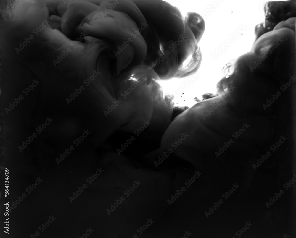 Abstract background with black ink in water Abstract background with black ink in water