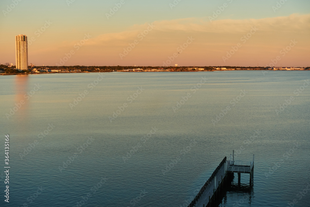 Fototapeta premium View of Clear Lake, Texas with orange sunset