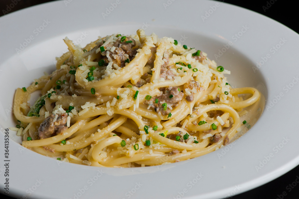 Pasta with meatballs, marinara sauce, Parmesan cheese and fresh Italian parsley. Classic American or Italian restaurant favorite. Homemade pasta with sauces, meats and cheeses.