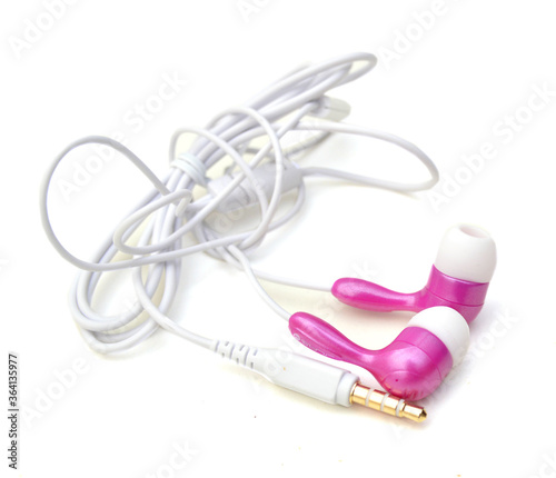 Pink and white earphones on white background.