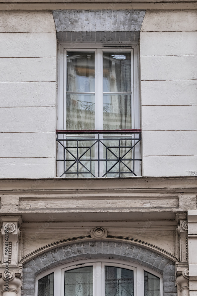 Old French house with traditional balconies and windows. Paris, France. Old French house with traditional balconies and windows. Paris, France.
