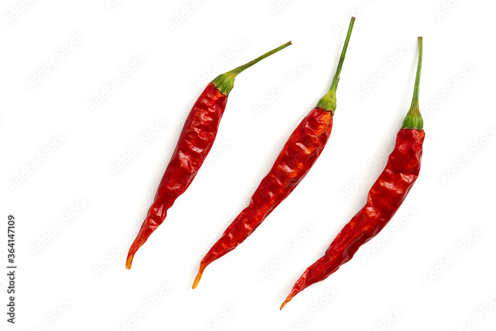 Dry pods of red chili peppers isolated on a white background. Top view, flat lay. Dry pods of red chili peppers isolated on a white background. Top view, flat lay.