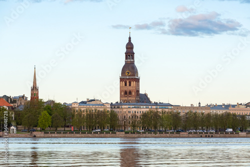 Riga, Latvia, view of the old city with the tower of St. Mary's Cathedral with reflections in the Daugava river