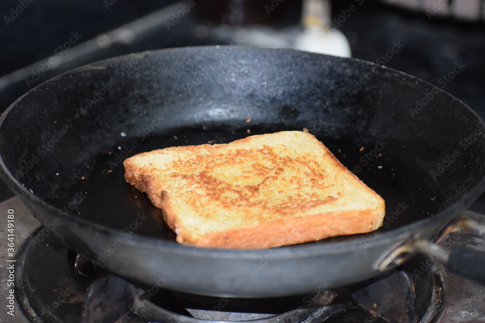 bread on frying pan bread on frying pan
