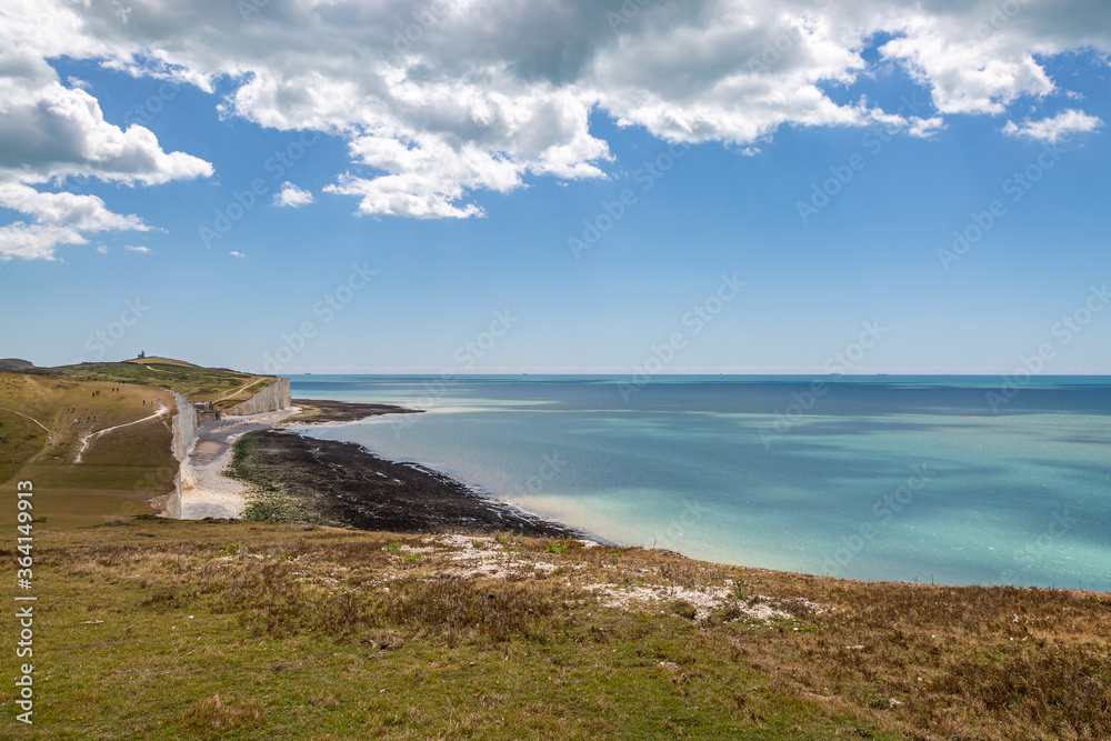 A view of the Seven Sisters Cliffs and the sea from along the South Downs Way, on a sunny summers day A view of the Seven Sisters Cliffs and the sea from along the South Downs Way, on a sunny summers day
