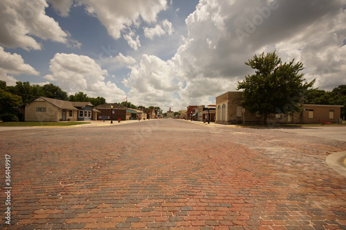 old town street of brick with awesome clouds