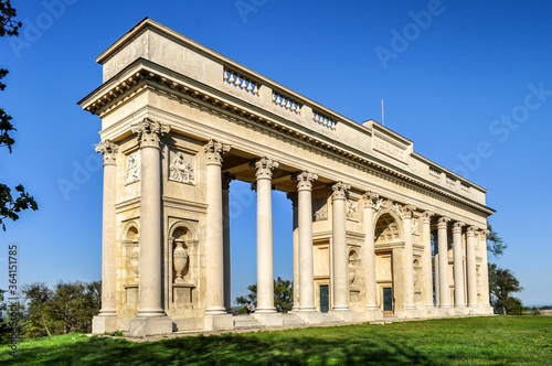 Rajsna Colonnade stands in a meadow by a small grove (Valtice, Czech Republic)