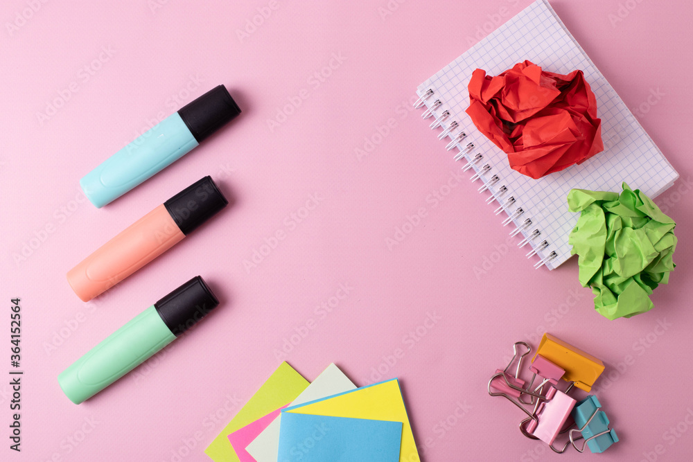 different stationary items on pink. flat lay