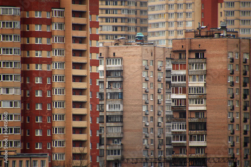 windows of brick houses in a residential area of the city with dense buildings