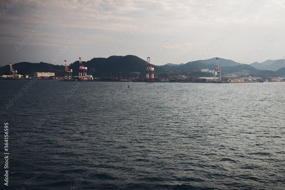 Sea water with cloudy sky, city of Busan South Korea.