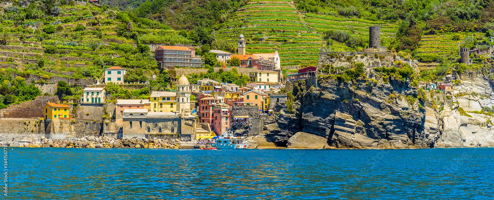 A panorama view towards the colourful Cinque Terre village of Vernazza in the summertime