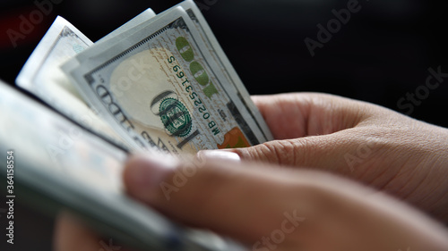 Close up of businessman hands count money cash.