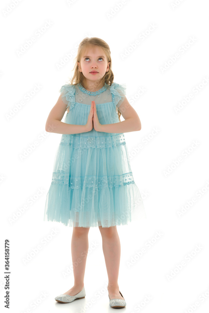 The little girl looks up.The concept of children's emotions. The little girl looks up.The concept of children's emotions.