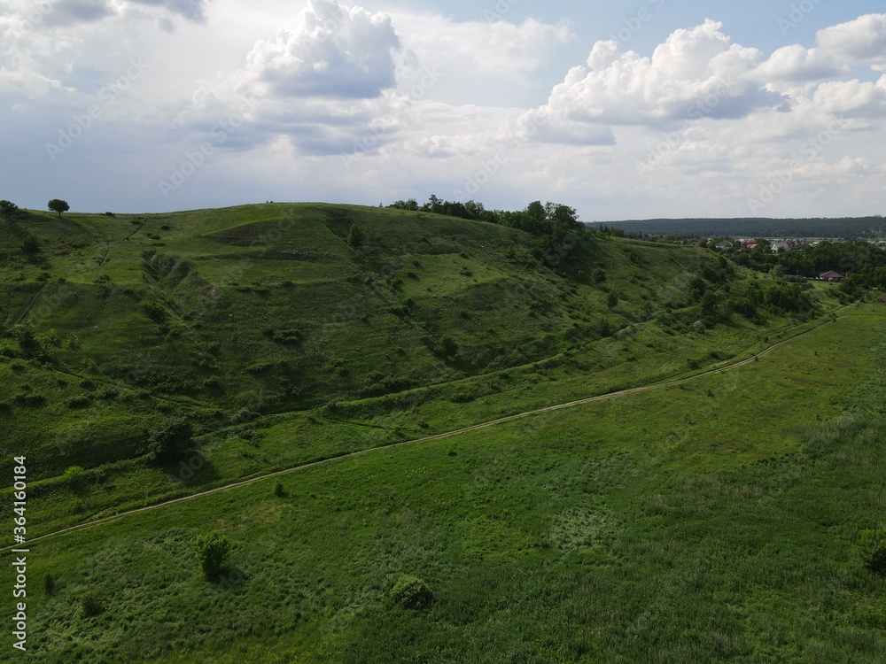 Aerial view of green hills in summer
