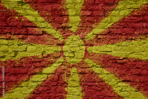 painted big national flag of macedonia on a massive old brick wall